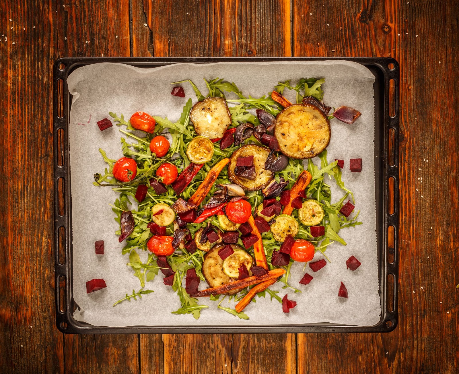 A pan of garlic butter roasted vegetables on a cooling rack.